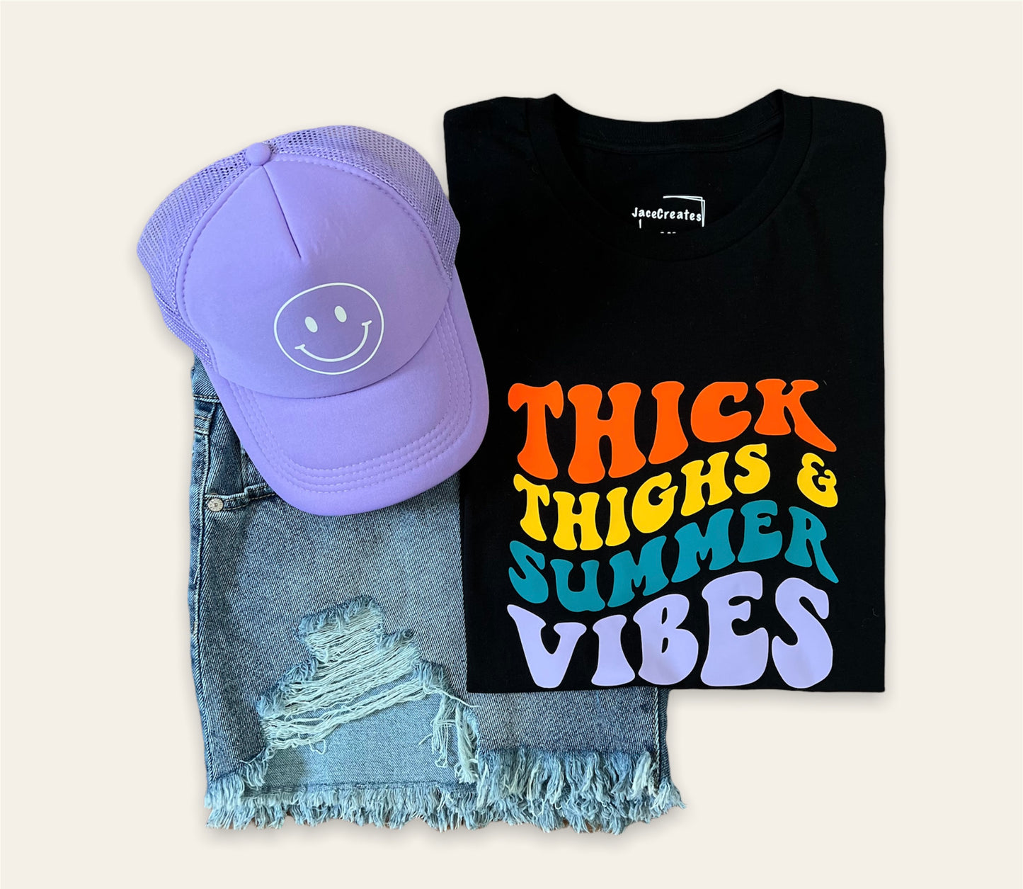 Perfect Summer Outfit. Black short sleeve t-shirt "Thick Thighs & Summer Vibes. With a smiley face lavender trucker hat. 